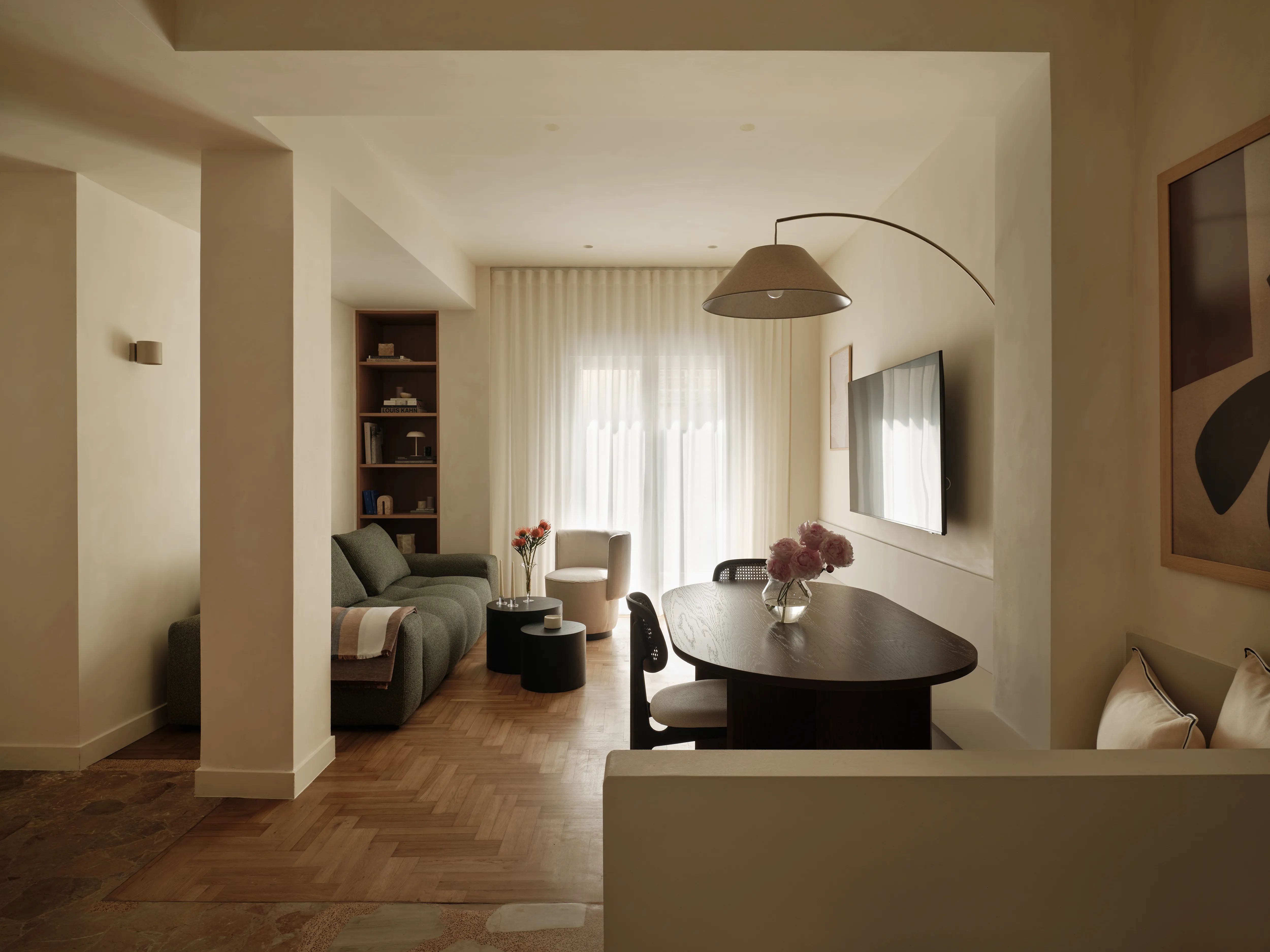 Living and dining spaces connected by the reorganised Thiseio apartment plan