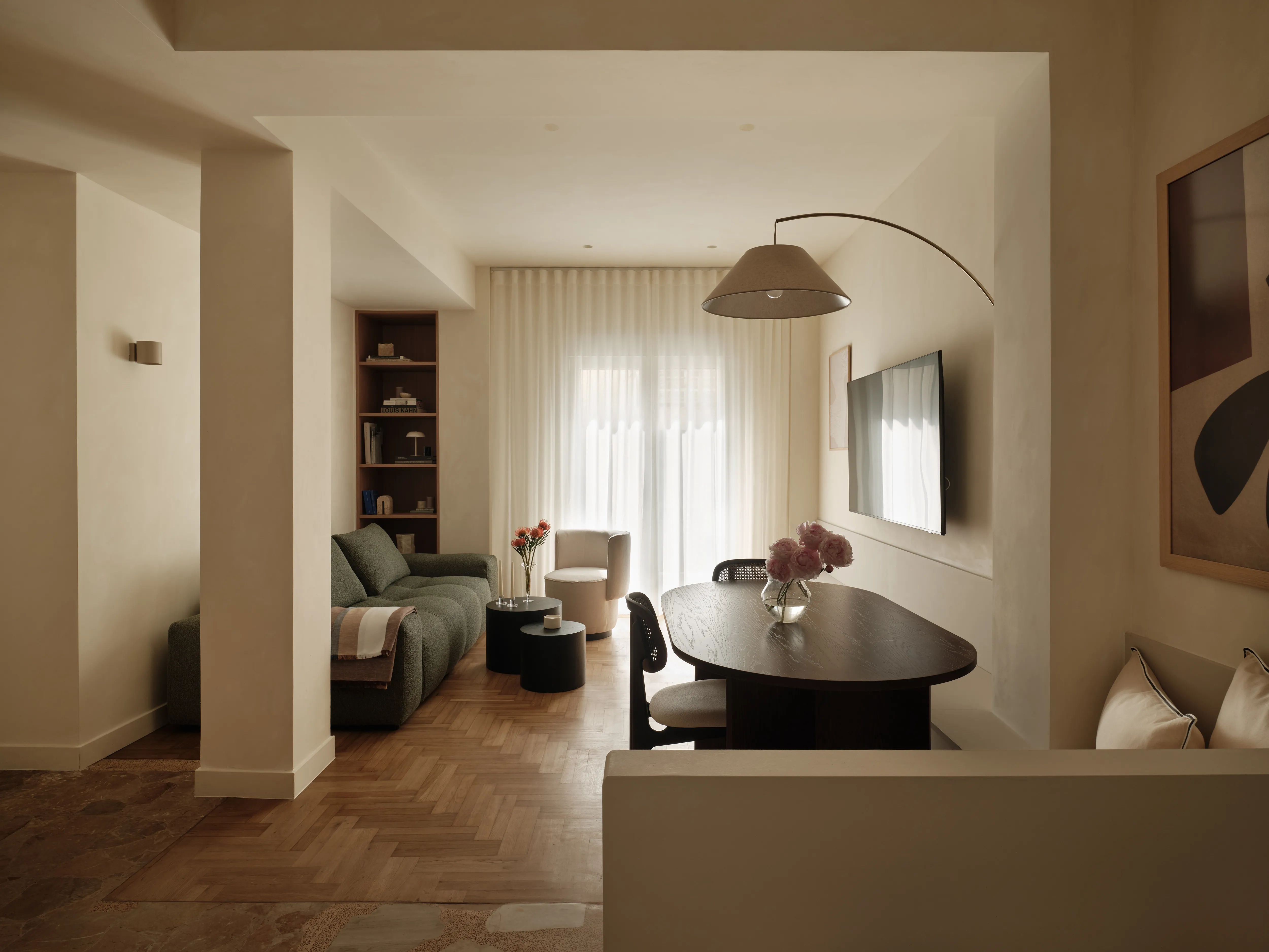 Living and dining spaces connected by the reorganised apartment plan