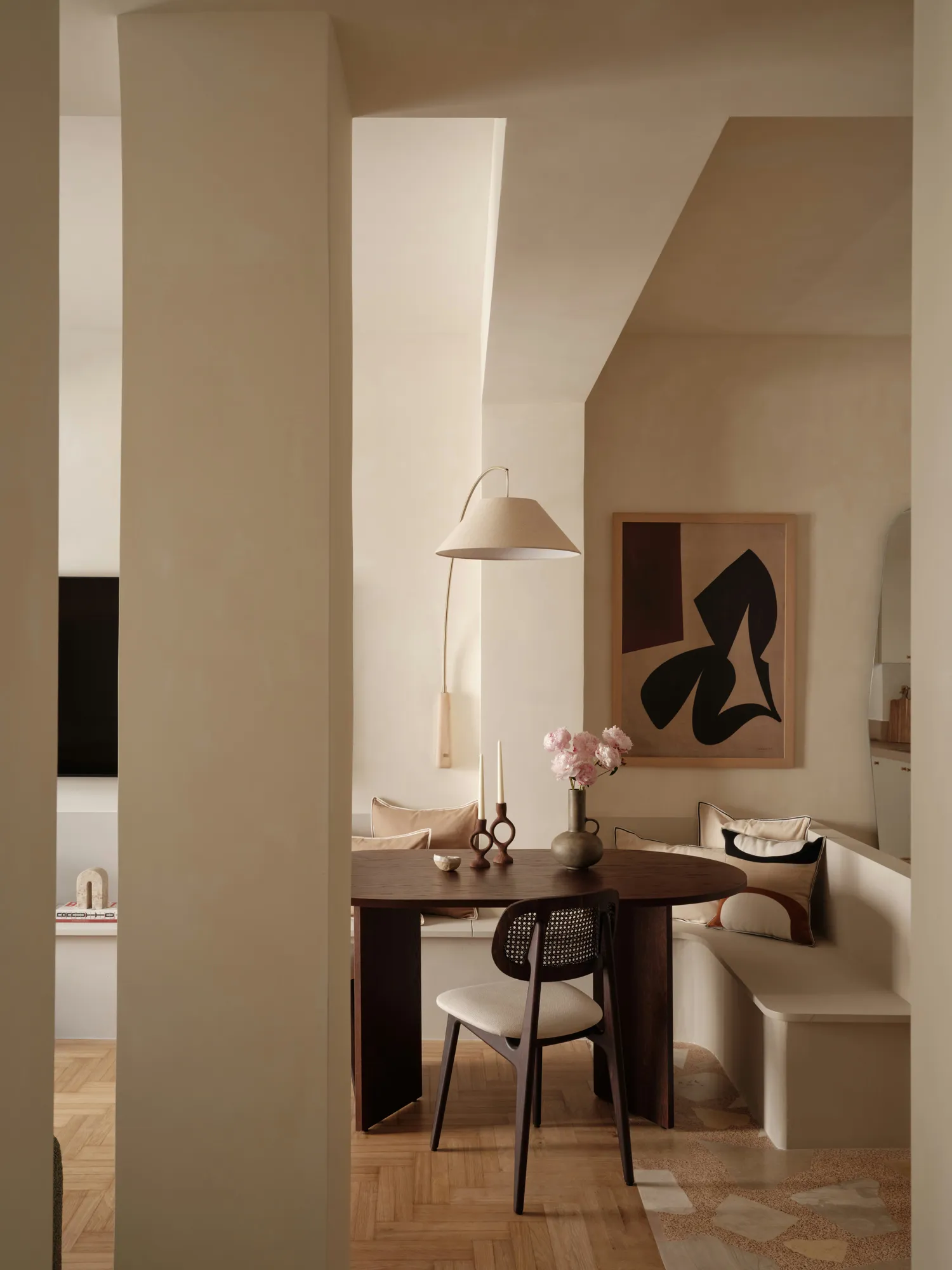Dining area framed by the apartment's structural columns