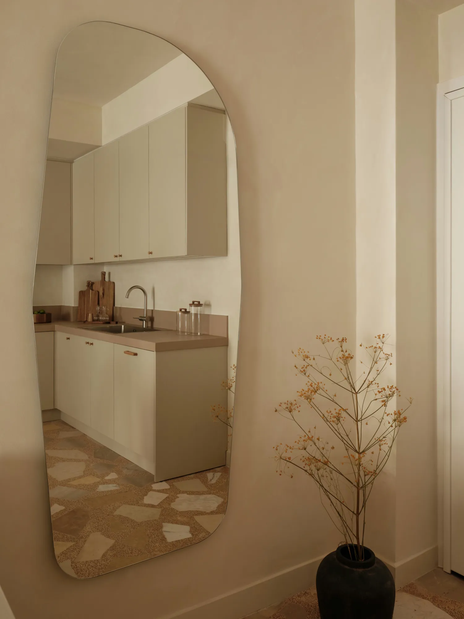 Kitchen cabinetry and worktop beside an internal column