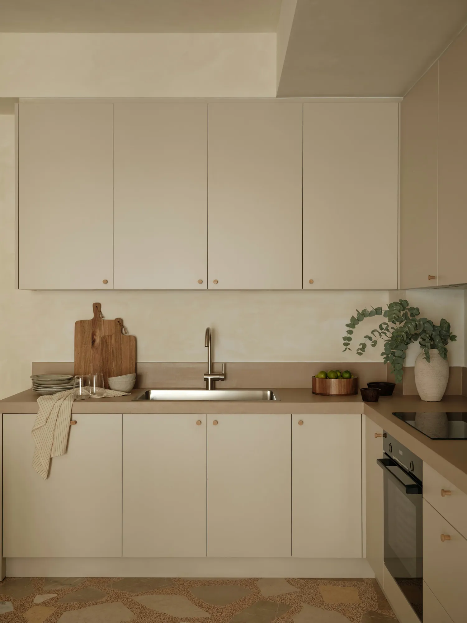Kitchen worktop with timber boards and eucalyptus branches