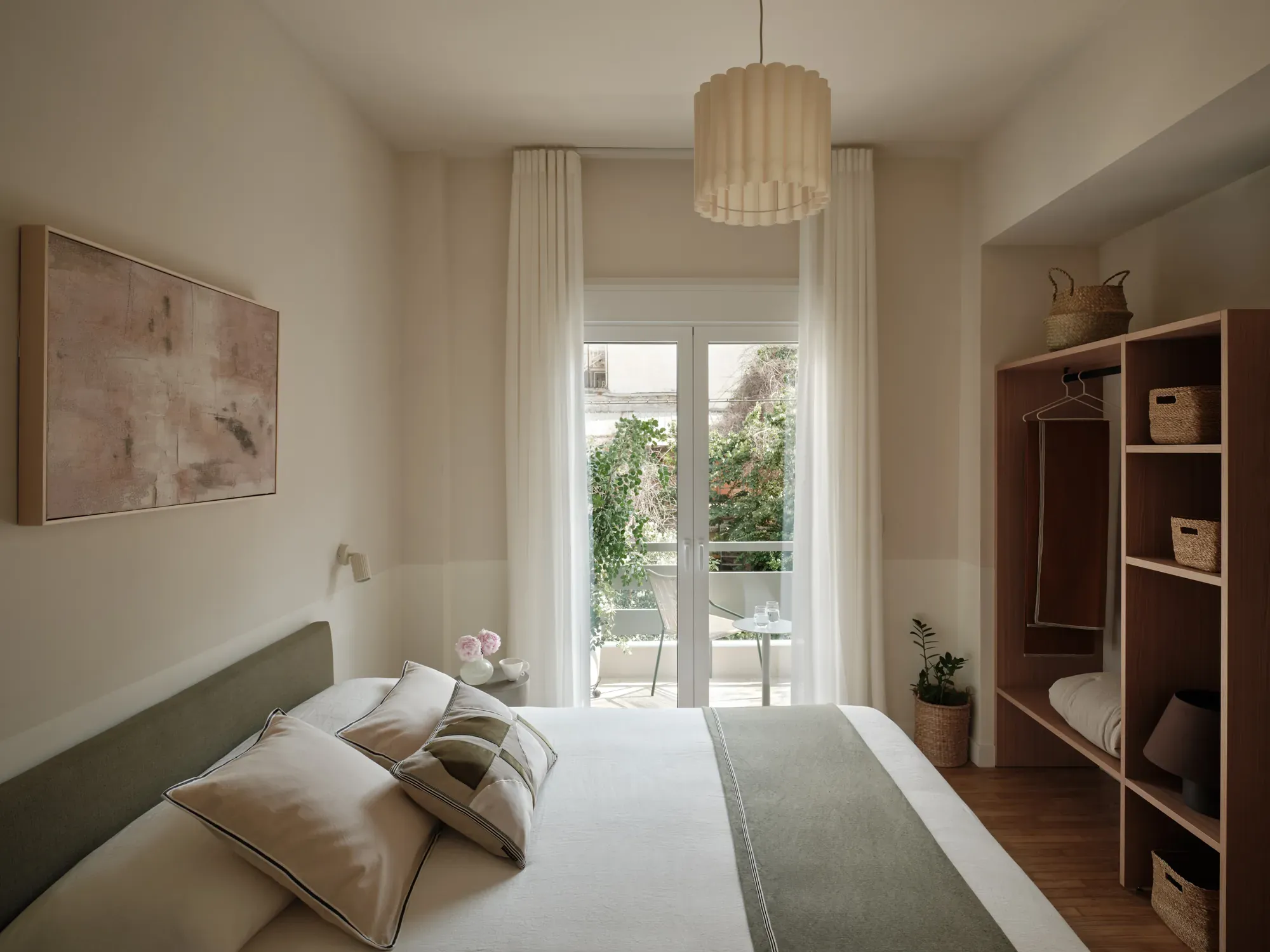 Bedroom with integrated timber storage and doors to the balcony