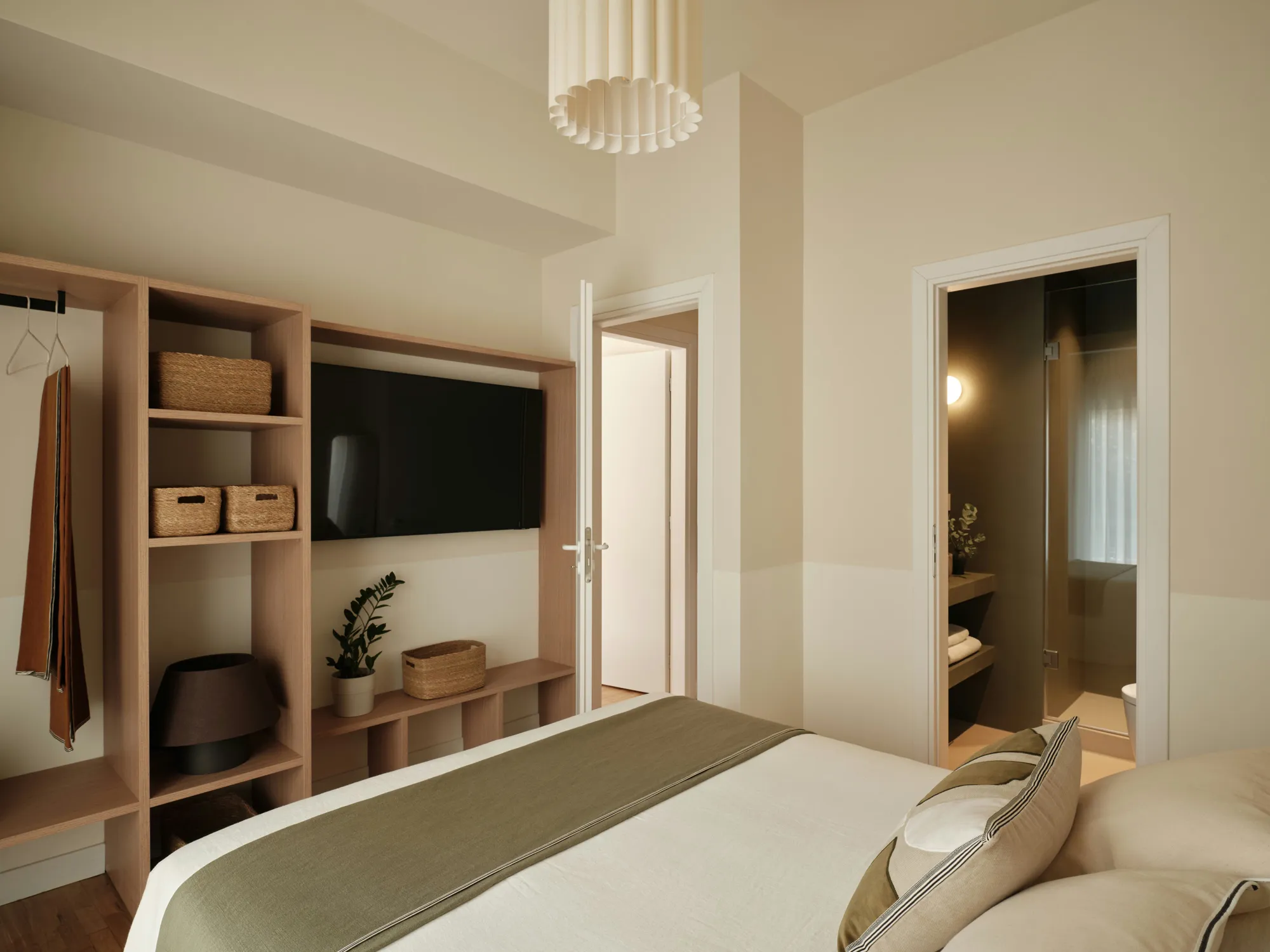 Timber storage wall opposite the bed in the principal bedroom