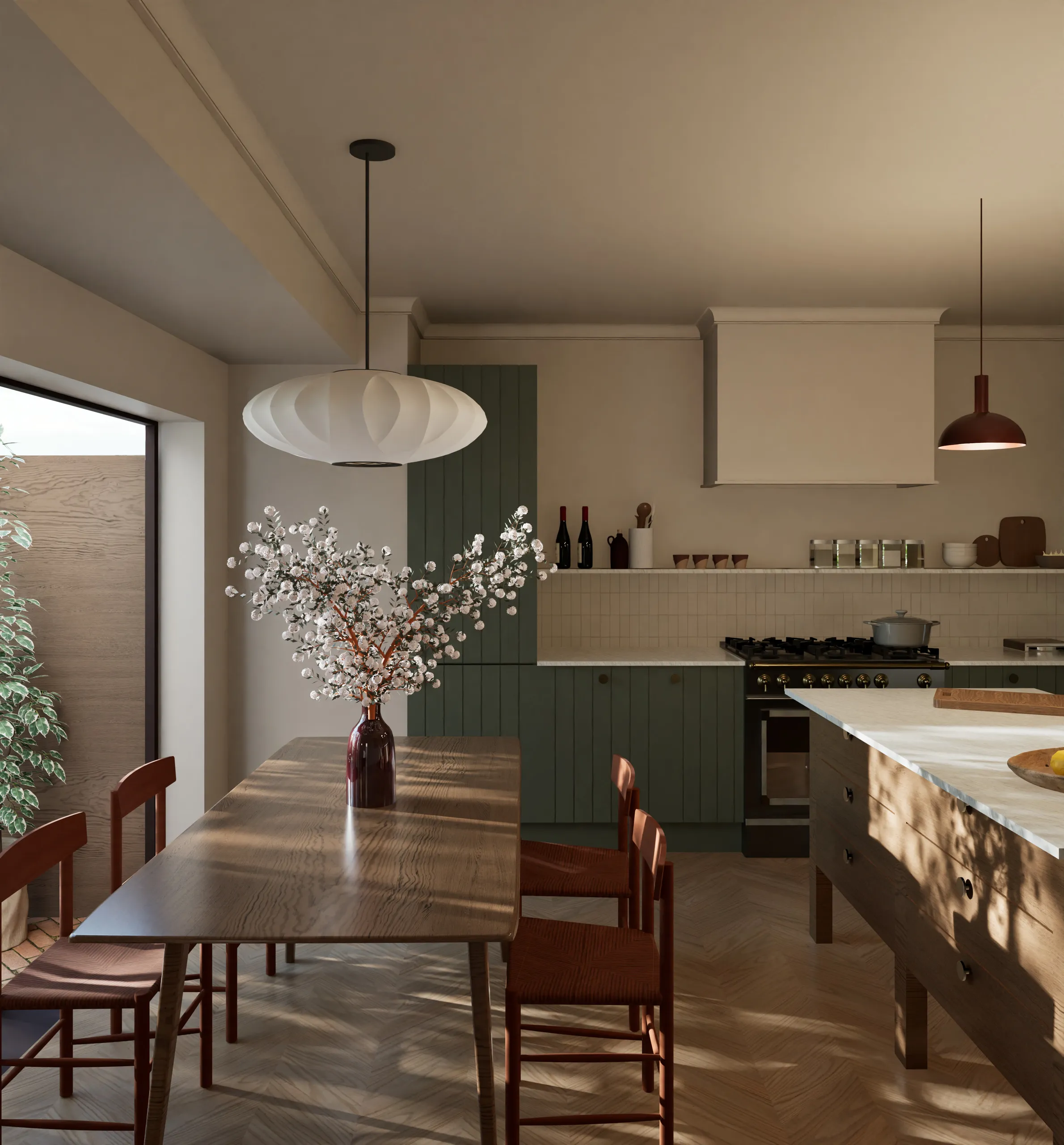 Sunlit kitchen and dining room with green cabinetry and timber furniture