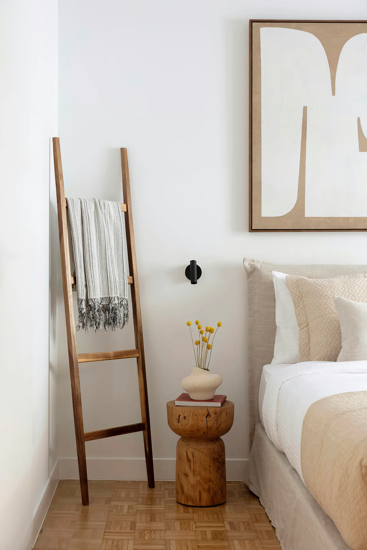 Bedroom detail with timber blanket ladder, bedside table and restored oak parquet