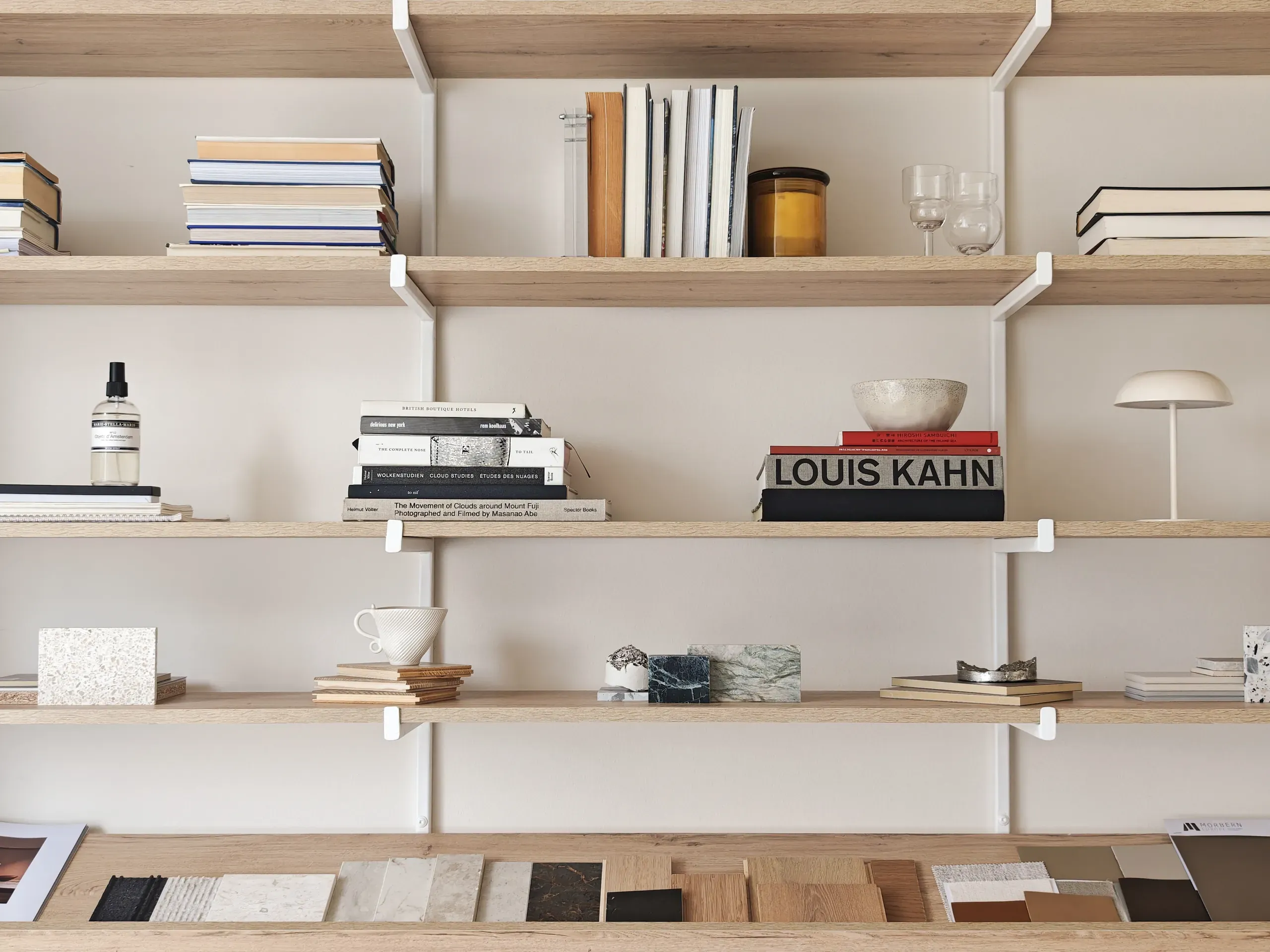 Timber shelving with architecture books and material samples inside Fineline Studio