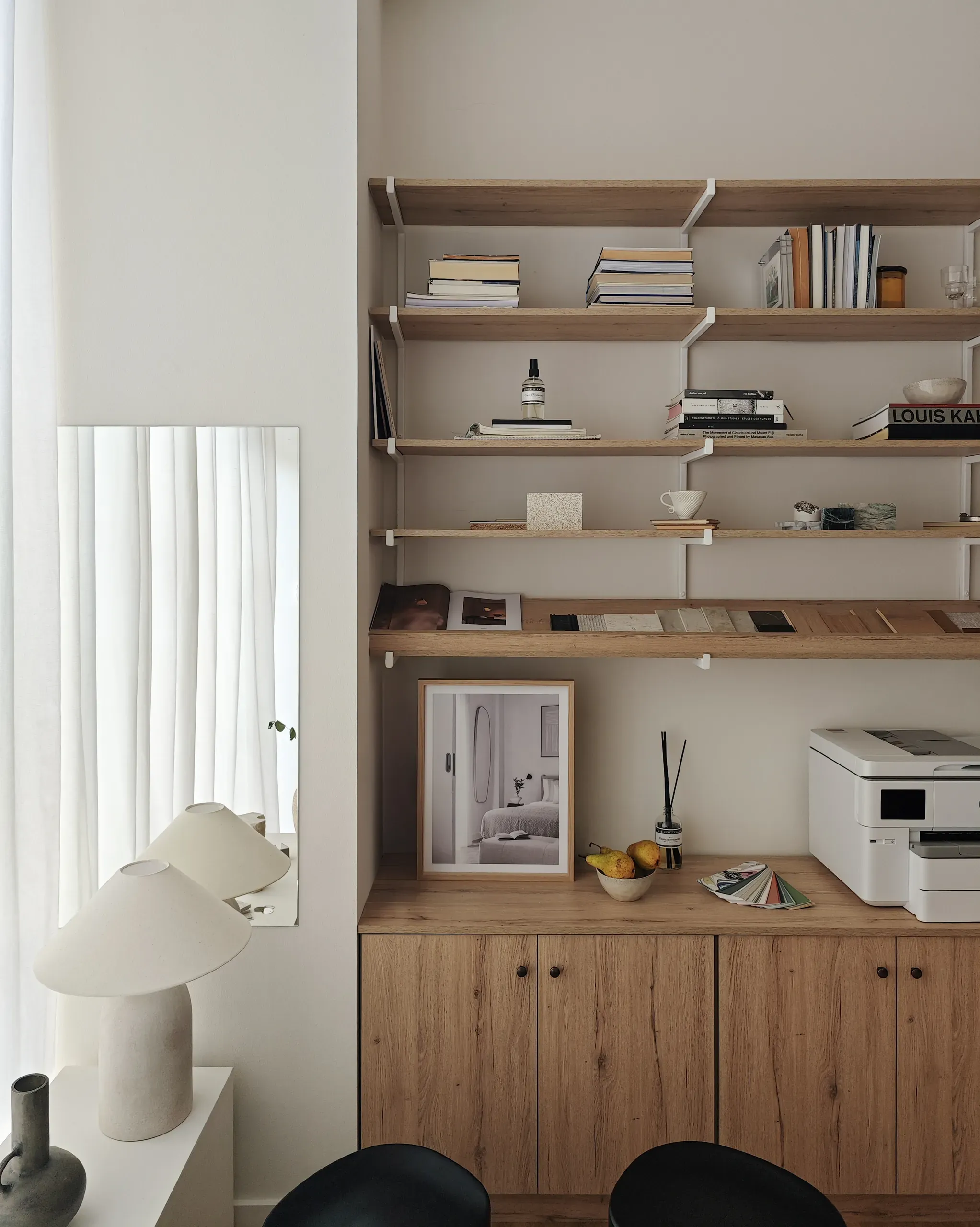 Material library, timber storage and mirror along the studio's working wall