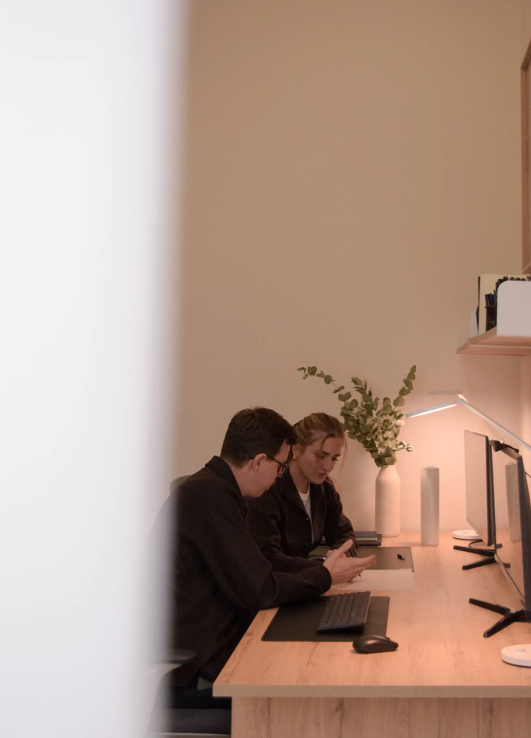 Fineline Studio directors working together at a desk in the Athens studio