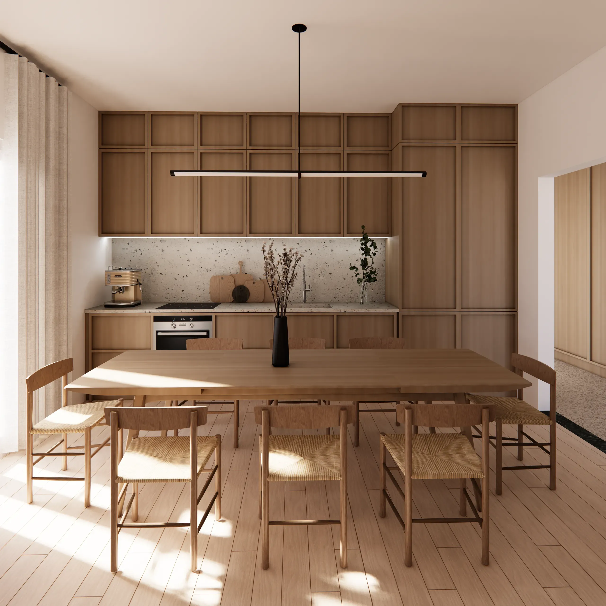 Timber kitchen and long dining table beneath a linear pendant light