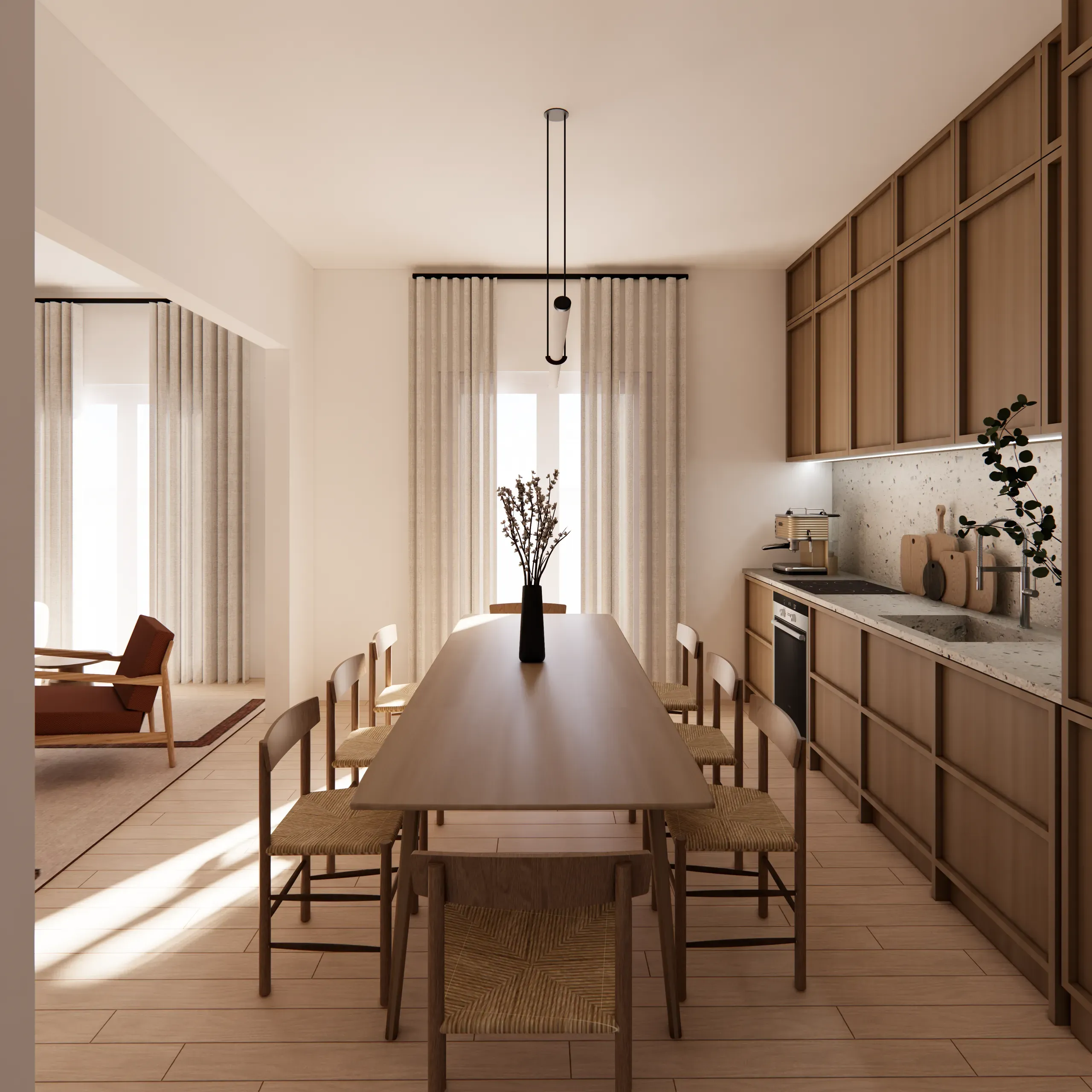 Dining table alongside the framed timber kitchen with the living room beyond
